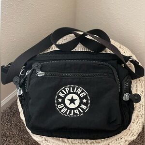 Kipling Black Bag with Logo, plenty of pockets. Great everyday bag.